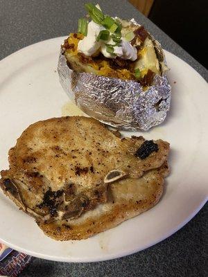 Grilled Pork Chops and loaded baked potato.