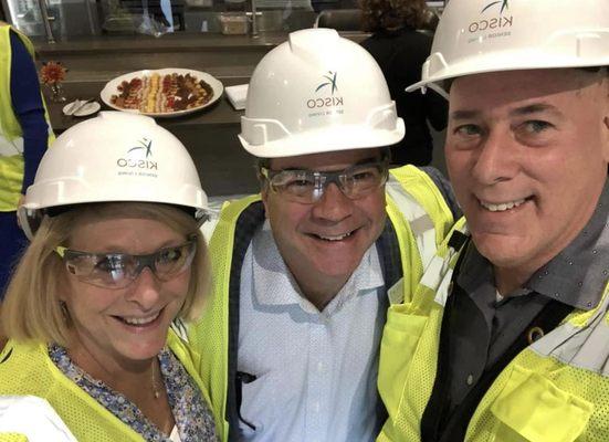 Caryn looking cute with her hard hat and goggles.  Touring a new community during constructions.  We stay up to date on new places openings.