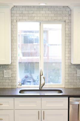 Loved out backsplash and chose to go all the way to the ceiling to frame in the window