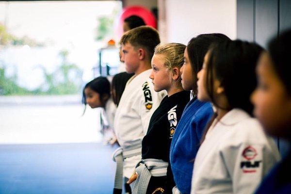 Kids lining up after class. Look at the discipline in their faces :) So cute!