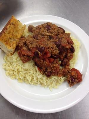 Chili and rice with a nice slice of garlic-chili bread.