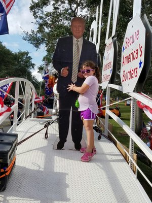 My daughter taking a picture with President Trump