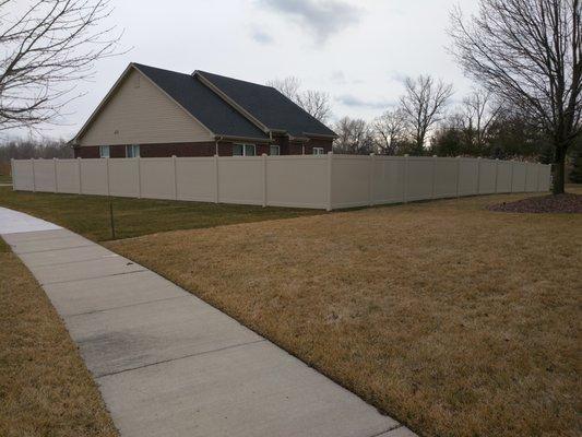 Tan privacy Somerville vinyl fence.