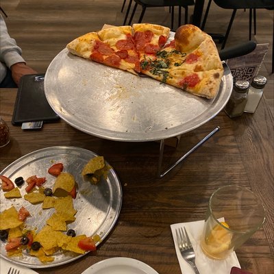 Half pepperoni lovers and half margarita pizza with the nachos yummy yummy