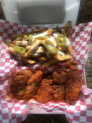 "Honey Hot and Lemon Pepper" flavored chicken tenders, along with an order of our "Cajun Ranch Fries"