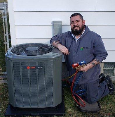 Jerry Jr. checking the refrigerant levels on a newly installed TRANE AC Unit.