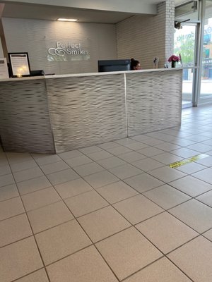 front desk area, and the six feet tape