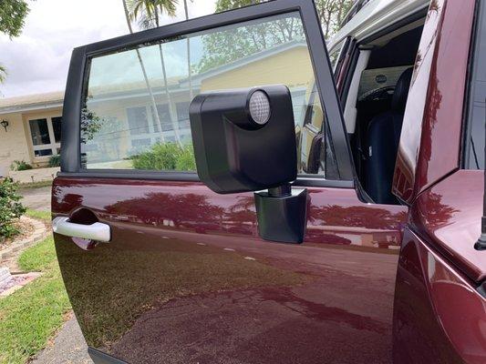 Passenger door and view of side mirror painted black