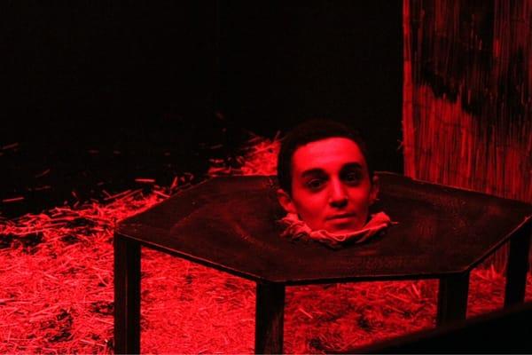 An illusion inside the haunted house! The head on a table cracking jokes...with his body nearby...waving at us!