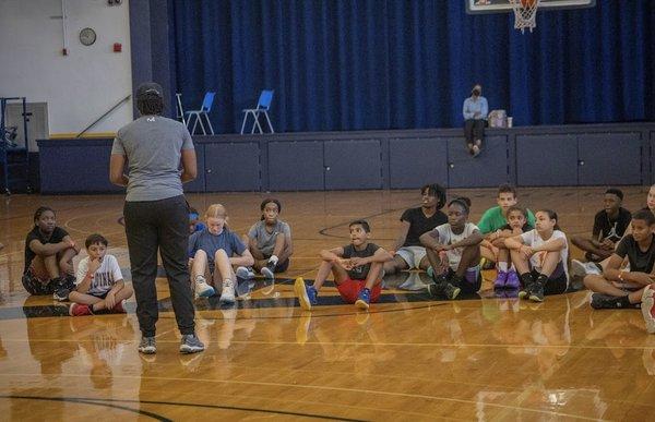 Guest speaker, professional player, speaking to players at clinic