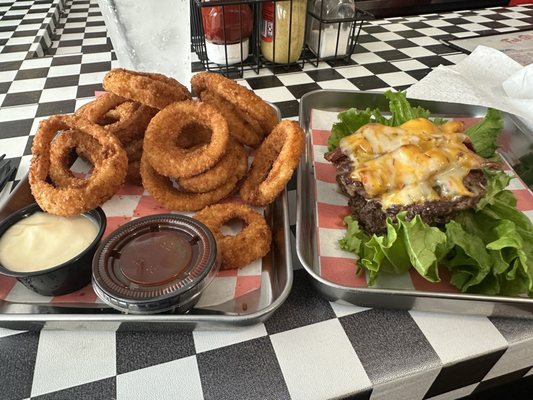 Burger on a lettuce wrap, onion rings