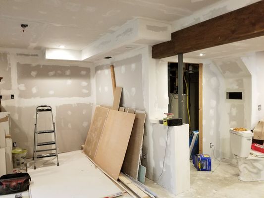 During complete basement finishing.