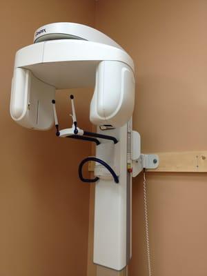 Sci-fi X-ray machine that circles your head to get a full picture (they also use a standard X-ray "pod" on a swiveling arm).