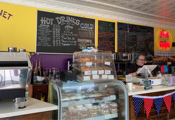 The counter at Coffee Planet where the staff is friendly & helpful.