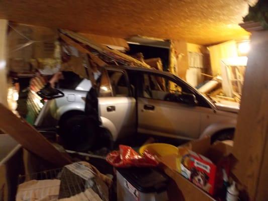 Car crashed into back of house.