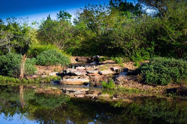 Little waterfall at one of the ponds for fishing.