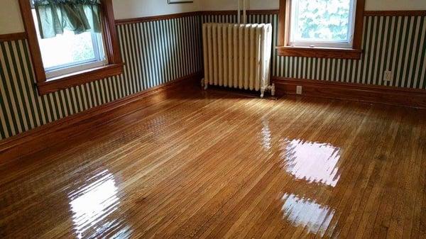 Refurbishing genuine hardwood floors to a brilliant shine.