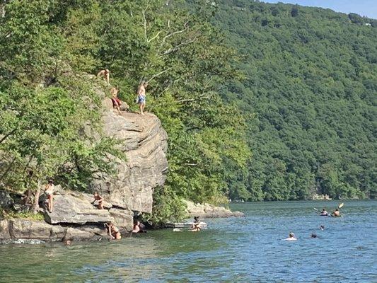 This is Chicken Rock North on the lake right side. With a rope swing. Fantastic. Anchor and hang with young and old.