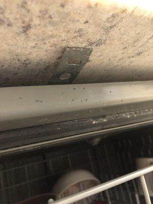 Dishwasher wasn't attached to countertop, fixed it with epoxy