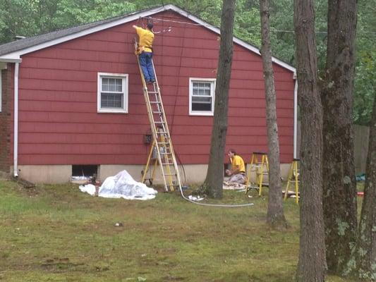 Here are the guys working on a 200 amp service upgrade in Marlton, NJ.  It started raining, but that didn't stop us!