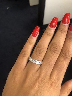 Beautiful emerald cut eternity band. I hate taking it off.