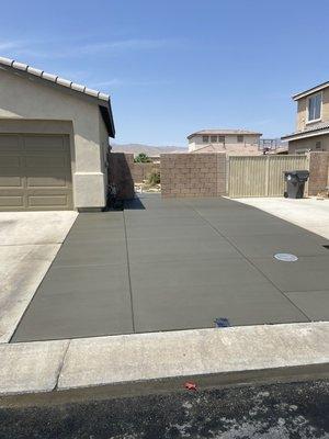 New driveway and rear yard pad, done right.