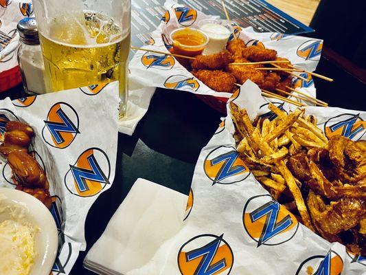 Happy Hour - Pretzel Bites w/Beer Cheese, 32 oz Beer, Chicken Skewers, & 'Baskets' 1/2 Fries/1/2 Onion Rings!