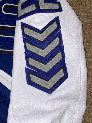 I got the fourth chevron through them and sewn on by them. It is the wrong color and size. It is also sewn on crooked and not aligned.