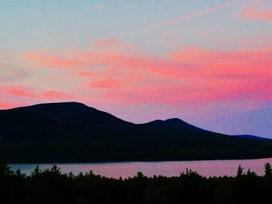 Catskill Mountains. Sunset reflected on clouds above Tonshi Mountain and seen on the surface of the Ashokan Reservoir.