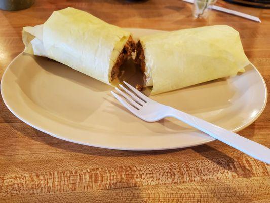 Breakfast burrito just arrived, wrapped.