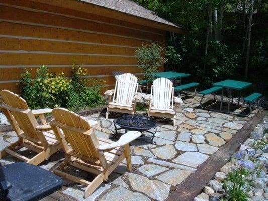 Relax on the stone patio with a book.