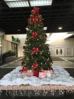 12/23/15. Tree in mall. Gifts below wrapped in Toy Fair iconic candy cane wrapping paper!