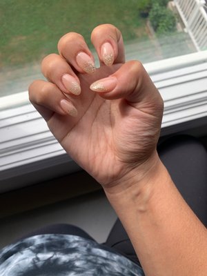 Ombré glitter nails with a nude color  Almond shape