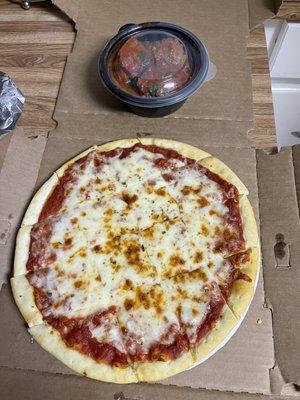 Small thin crust cheese pizza with an appetizer side of meatballs