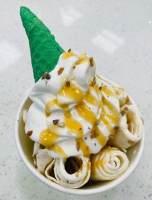 Rolled Salted Caramel Ice Cream with whip cream, caramel and a green come!