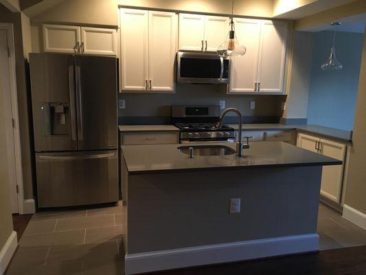 Fully renovated kitchen - sink, plumbing,Samsung Fridge, appliances, cabinets, tile floors marble