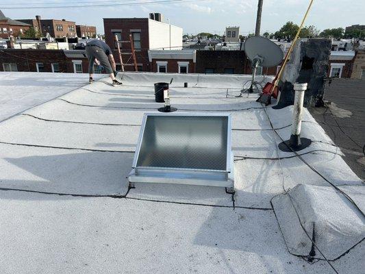 New skylight new Certainteed white granulated rubber roof system