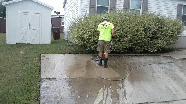 Pressure washing driveway with 16 inch surface cleaner.