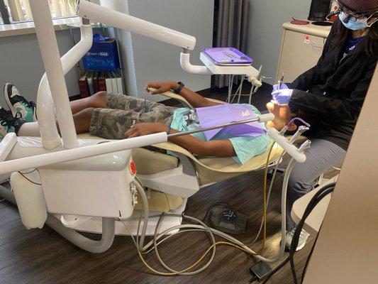 Getting his cleaning done by one of the best hygienist.