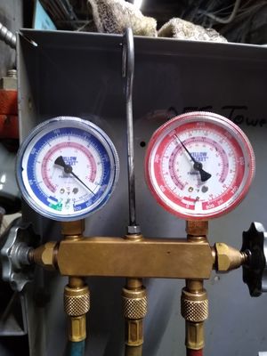 Checking refrigerant pressure is a critical step of recharging an AC unit.