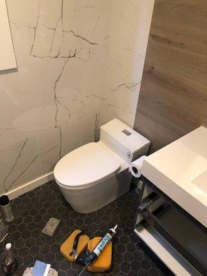 Installation toilet, new tile on the wall and floor