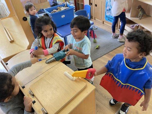 Dramatic Play: Playing pretend construction workers