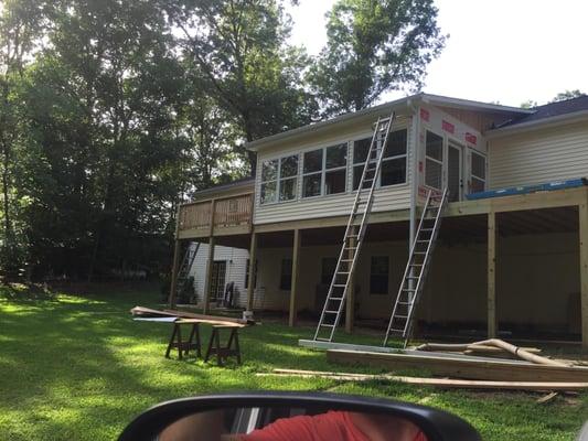 Remove existing deck, replace with 2 decks and a room enclosure between.