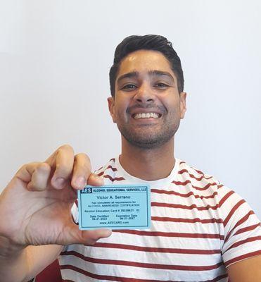 Victor was happy to receive his AES Blue Alcohol Awareness Certification Card so he can serve alcohol on flights.