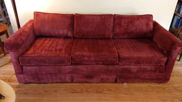 Red velour sofa after cleaning