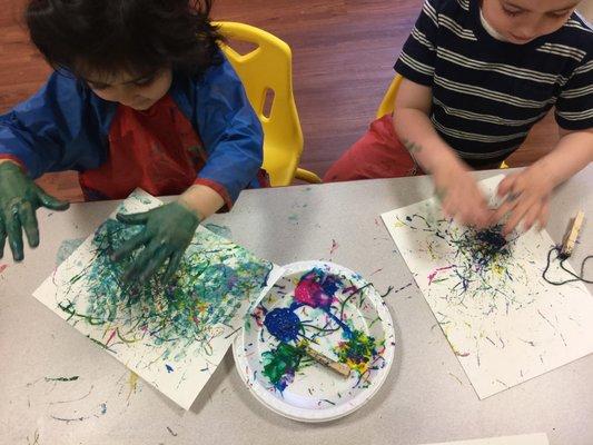 Children engage in Jackson-Pollock inspired art