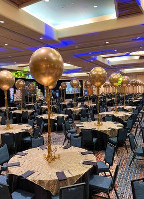 Tall and chic gold balloon centerpieces