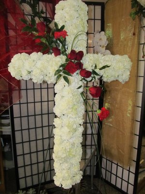 Beautiful cross with red roses