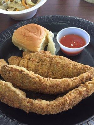 Fried fish with dinner roll and hot sauce