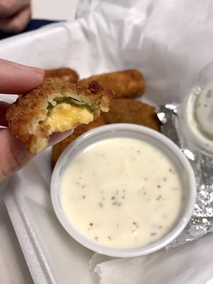 jalapeno poppers with complimentary ranch dressing dipping sauce.